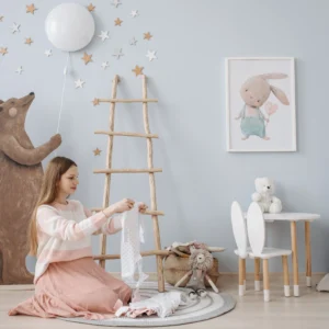 Newborn clothing checklist: parent organizing baby clothes in a nursery